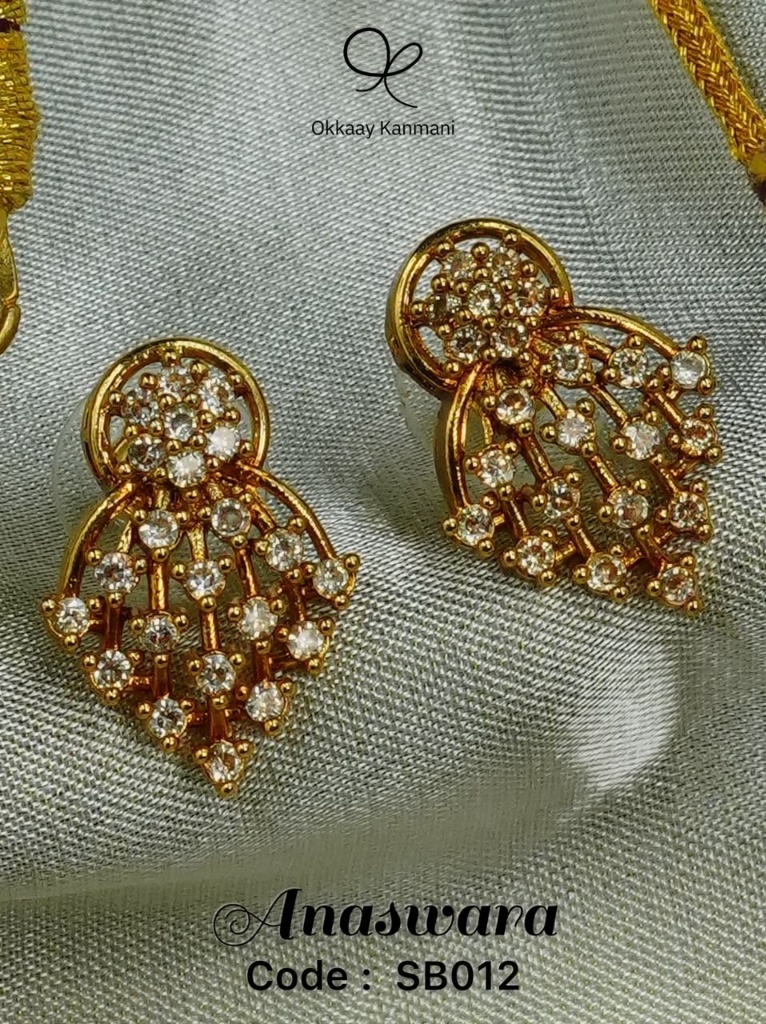 Anaswara handcrafted gold earrings on silk